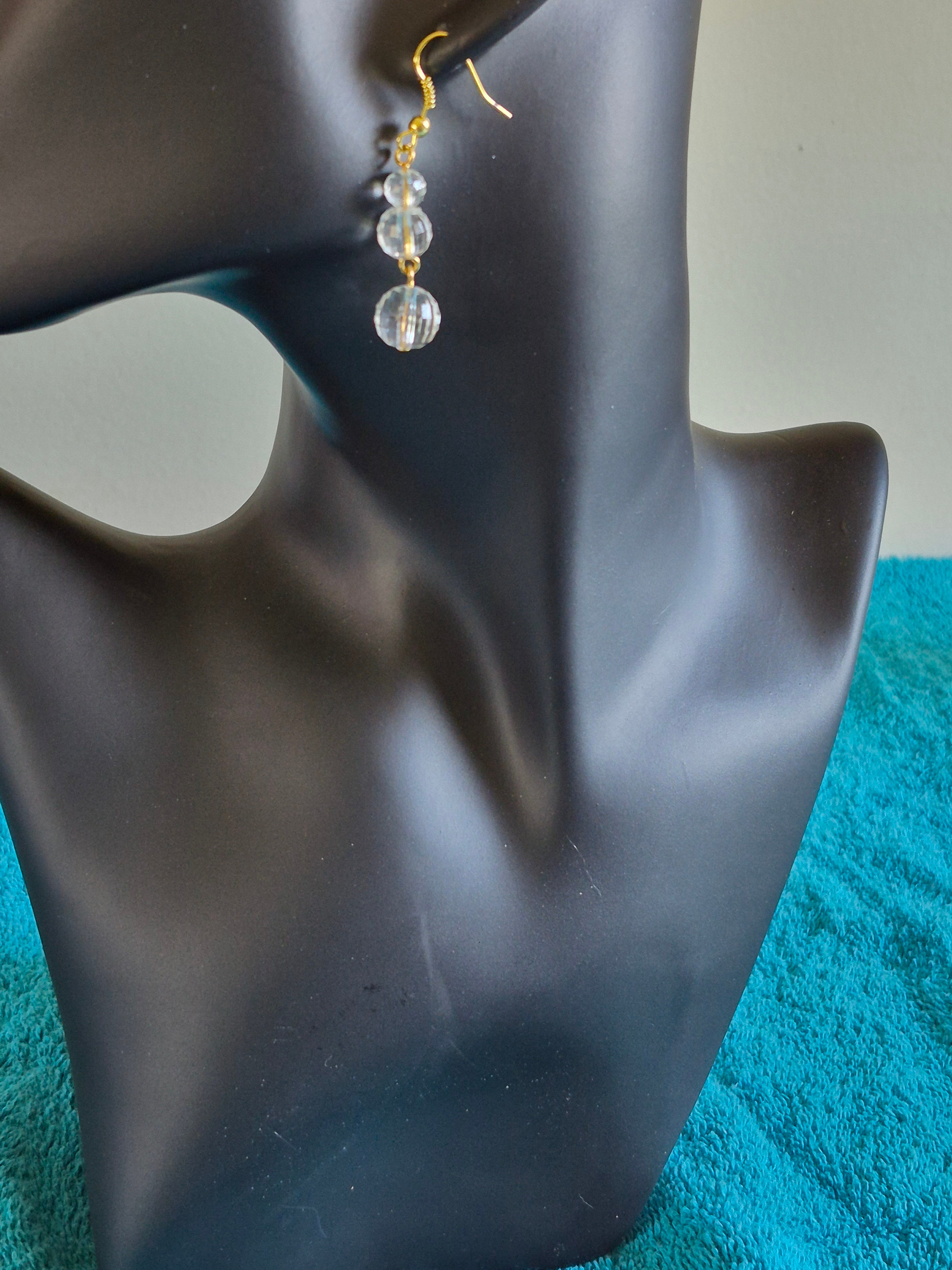 Crystal clear acrylic bead and gold colored hook earrings