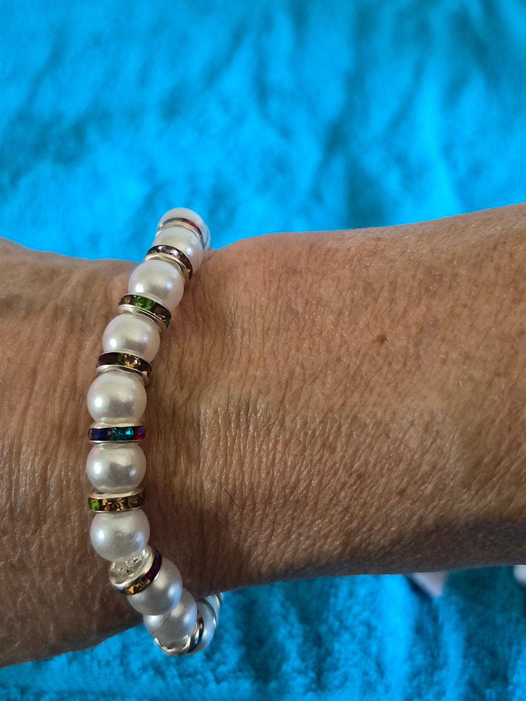 White bead stretch bracelet with multicolored spacers
