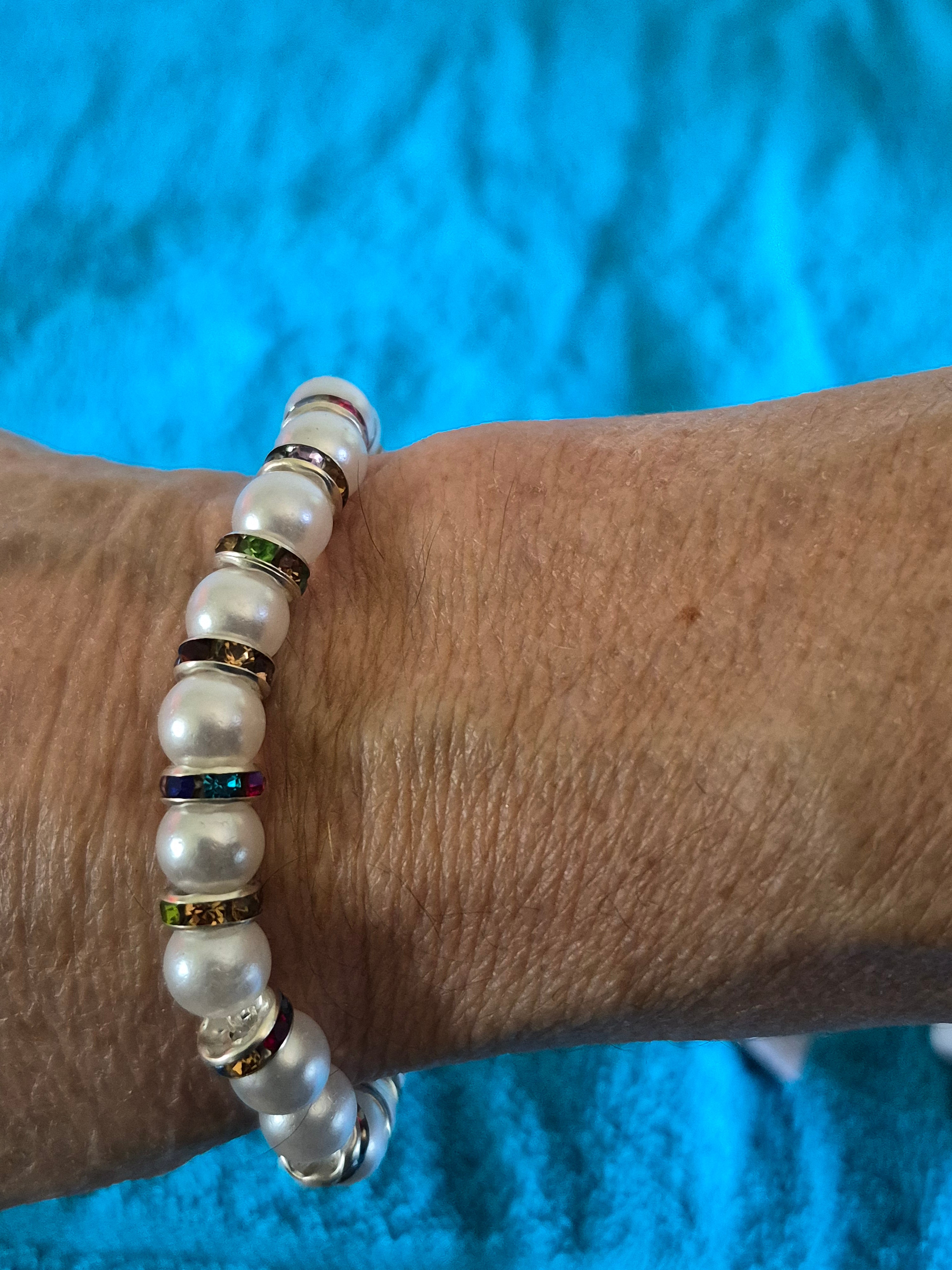 White bead stretch bracelet with multicolored spacers