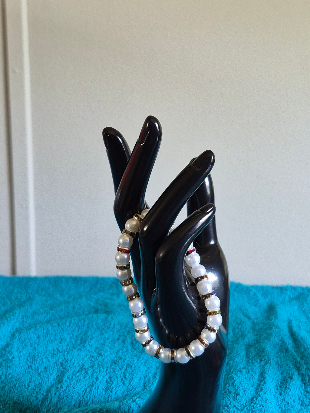 White bead stretch bracelet with multicolored spacers